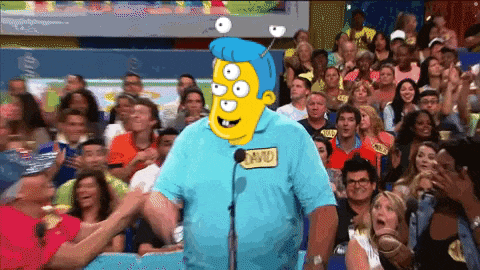 a man in a blue shirt with a name tag that says david stands in front of a crowd
