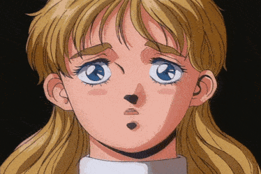 a close up of a girl 's face with blonde hair and blue eyes