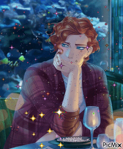 a man with red hair is sitting at a table with a glass of wine and a plate of food with the word picmix on the bottom