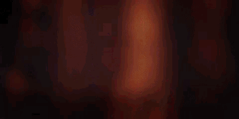 a woman is holding a gun with the words now streaming behind her