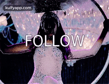 a woman in a white dress is holding a hula hoop and the word follow is on the bottom .