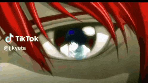 a close up of a person 's eye with a tiktok logo behind it