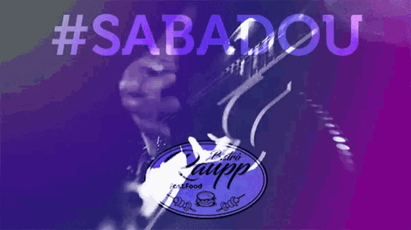 a person playing a guitar in front of a #sabadou logo