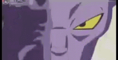 a close up of a purple and yellow cartoon character 's face .