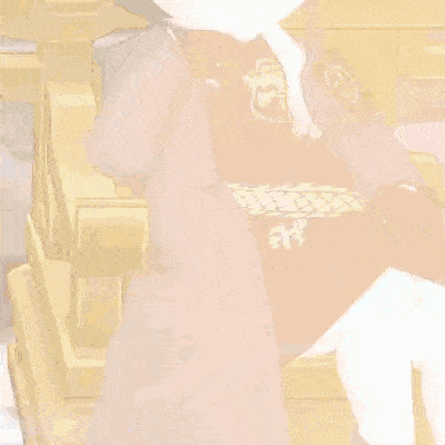 a person in a suit is sitting in a chair