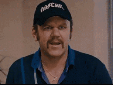 a man with a mustache and a hat that says nascar on it .