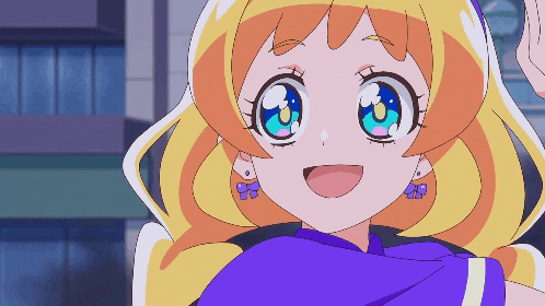 a girl with blonde hair and blue eyes is wearing earrings
