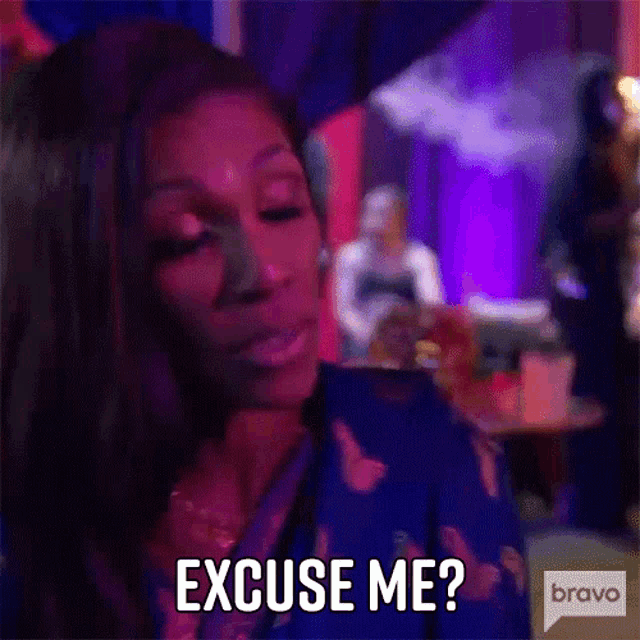 a woman is making a funny face and saying `` excuse me '' .