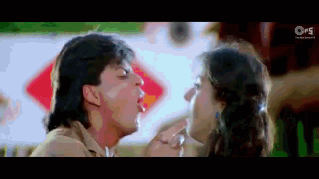 a man and a woman are kissing in a movie