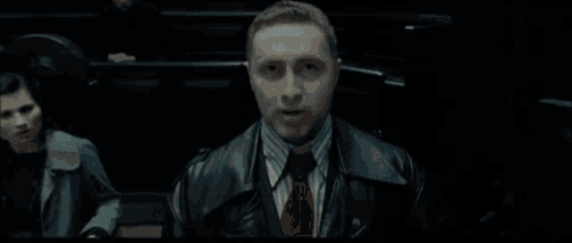 a blurry picture of a person 's face with a dark background