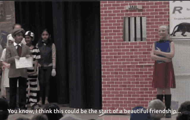 a group of children are standing in front of a jail scene