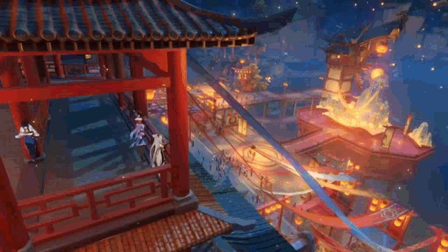 a group of people are standing on a balcony overlooking a river with lanterns flying in the air .