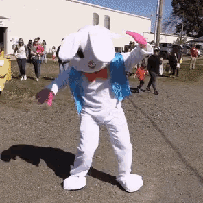 a person dressed as an easter bunny with pink gloves