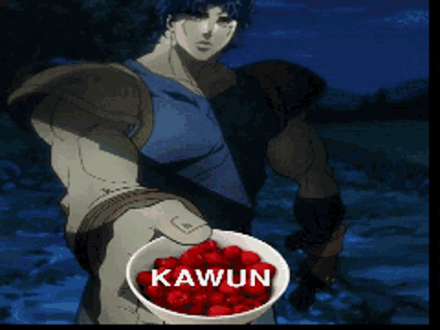 a man holding a bowl of red berries with kawun written on the bowl