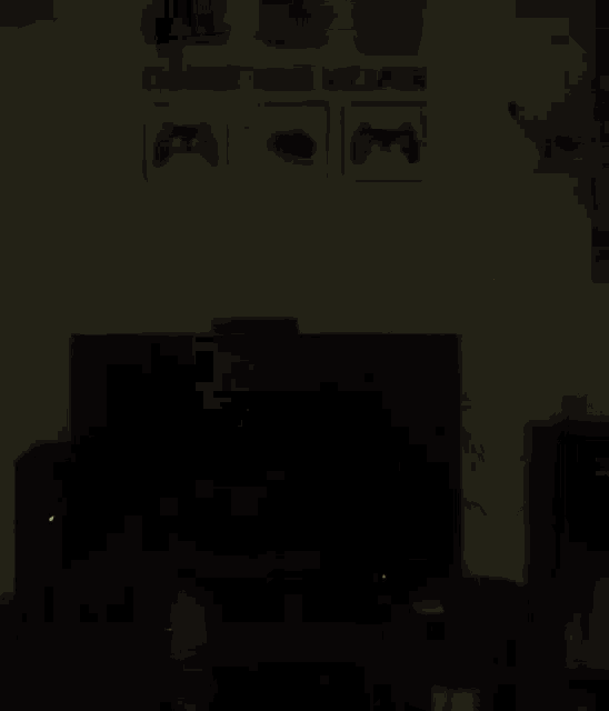 a close up of a gun in a dark room with a blurred background .