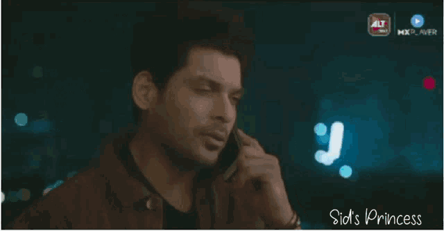 a man is talking on a cell phone with the words sid 's princess on the bottom right