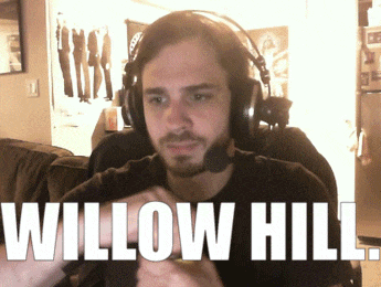 a man wearing headphones and a microphone says willow hill in white letters