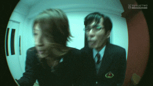 a blurred image of a man and a woman with the word turtletwo in the corner