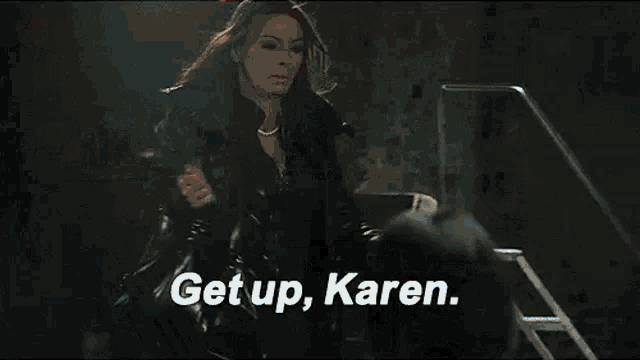 a group of women are sitting around a table with the words `` get up , karen '' .