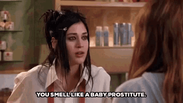a woman is talking to another woman in a store and says `` you smell like a baby prostitute . ''