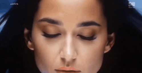 a close up of a woman 's face with the word mtv on the bottom right