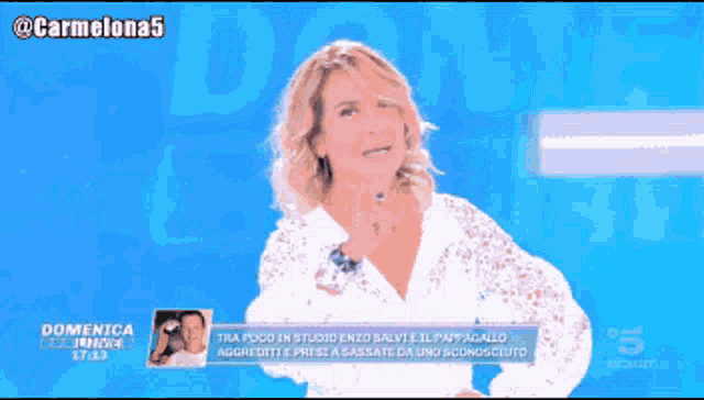 a woman in a white lace shirt is pointing up with the words partiamo written below her