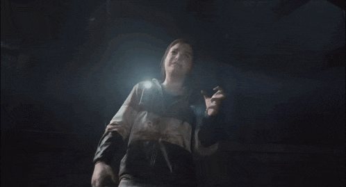 a person with blood on their face is looking up at the light