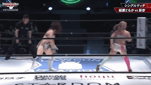 two women wrestling in a ring that says stardom on it