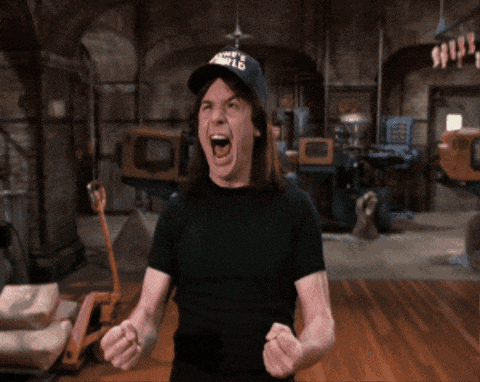 a man wearing a hat that says wayne 's world is screaming