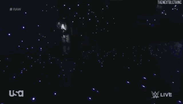 bray wyatt is holding a lantern in his hand