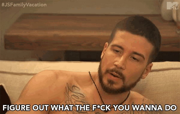 a shirtless man with a beard is sitting on a couch and says " figure out what the f*ck you wanna do "