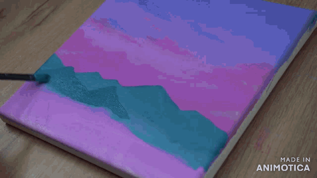 a painting is being painted on a canvas with the words made in animotica on the bottom