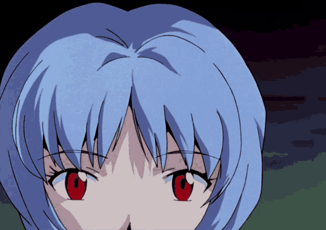 a close up of a girl 's face with red eyes
