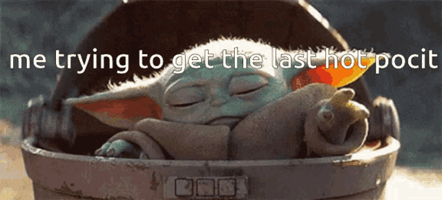 a baby yoda laying in a bucket with the words me trying to get the last hot pocit