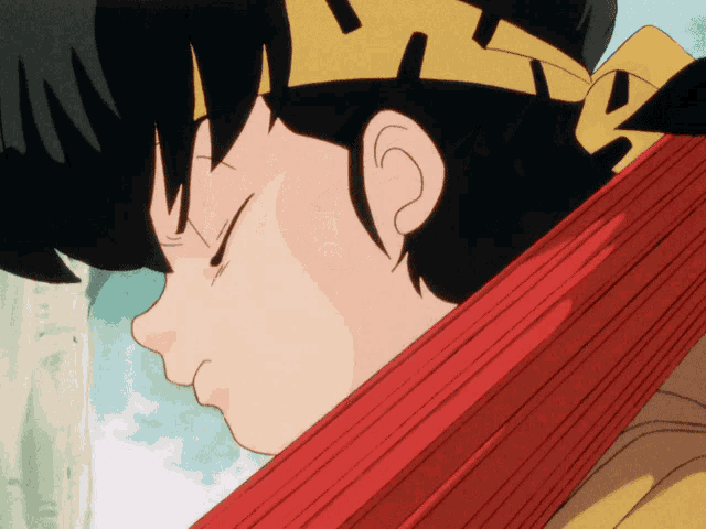 a close up of a person 's face with a yellow headband and a red umbrella