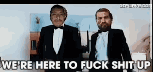 two men in tuxedos are standing next to each other with the words we 're here to fuck shit up behind them