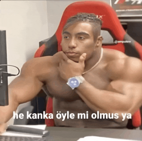 a shirtless man sitting in a red chair with the words he kanka öyle mi olmus ya written on the bottom