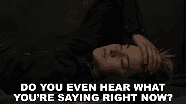 a woman laying on a bed with her hand on her forehead and the words do you even hear what you 're saying right now