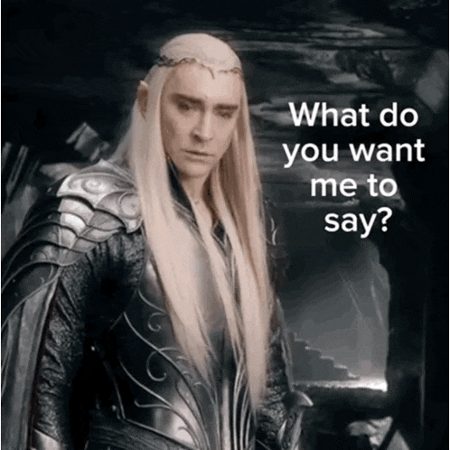 a man with long blonde hair is wearing armor and a crown and says what do you want me to say