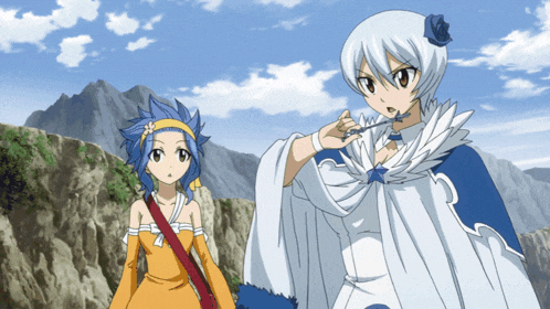 two anime characters are standing next to each other in front of a mountain