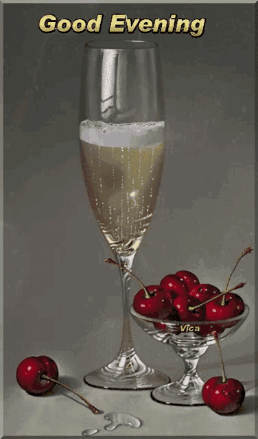 a glass of champagne and a bowl of cherries with the words good evening on the bottom