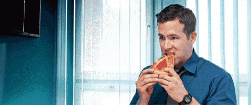 Ryan Reynolds Eat GIF - Ryan Reynolds Eat Pizza GIFs