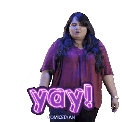 a woman in a purple shirt says yay