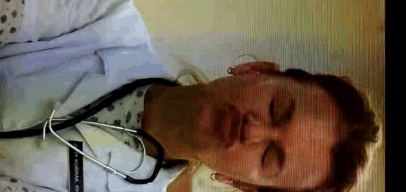 a doctor with a stethoscope around his neck and a name tag that says ' smithsonian ' on it
