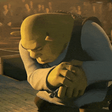 shrek from the movie shrek is kneeling down and looking at something