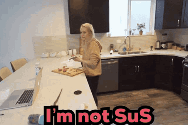 a picture of a woman in a kitchen with the words i 'm not sus