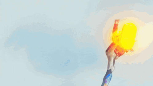 a close up of a burning match with a blue sky in the background