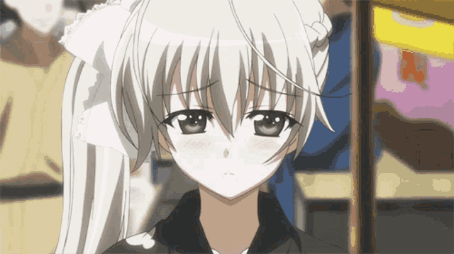 a girl with a bow in her hair is looking at the camera