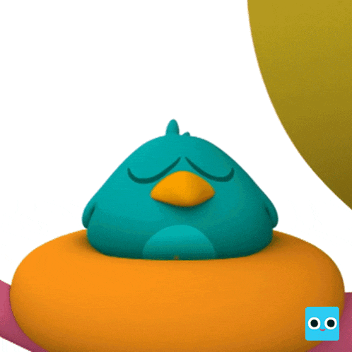 a blue bird with a yellow beak sits on an orange cushion