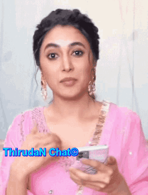 a woman in a pink dress is holding a cell phone with the words " hiruda n chat " written on the bottom